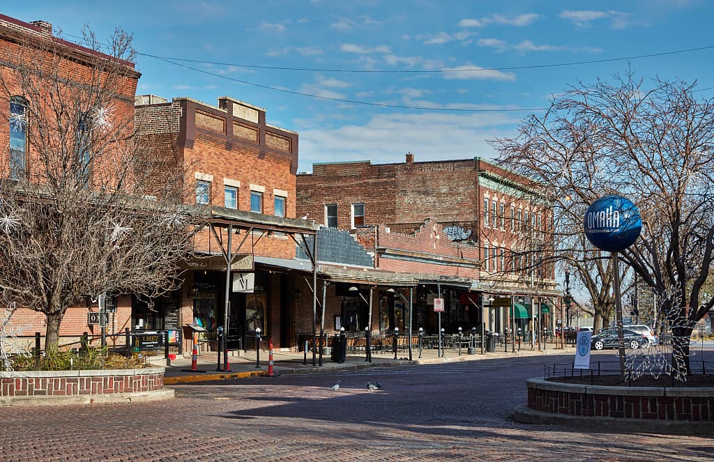 Brick storefronts and covered sidewalks in Omaha’s Old Market
